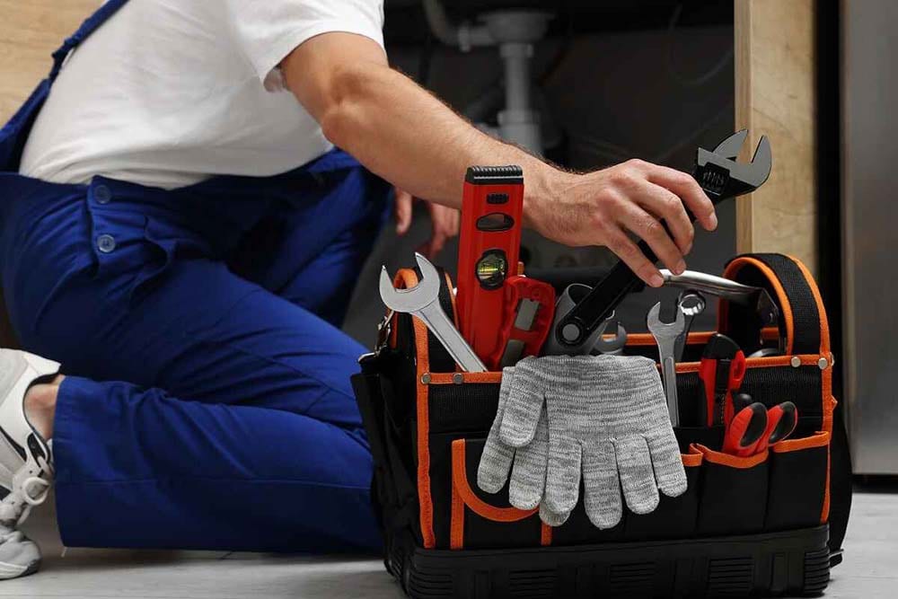 plumber with tools