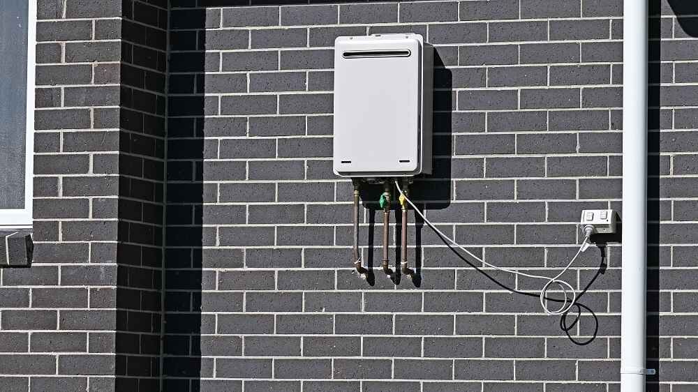 A tankless water heater mounted on a wall