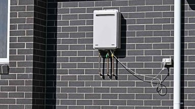 A tankless water heater mounted on a wall
