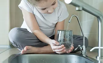 kid getting purified water