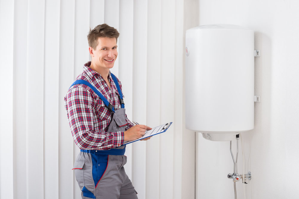 person checking tankless water heater