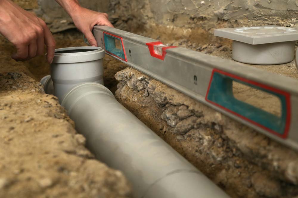 Accurate Backflow technician working on sewer line repairs